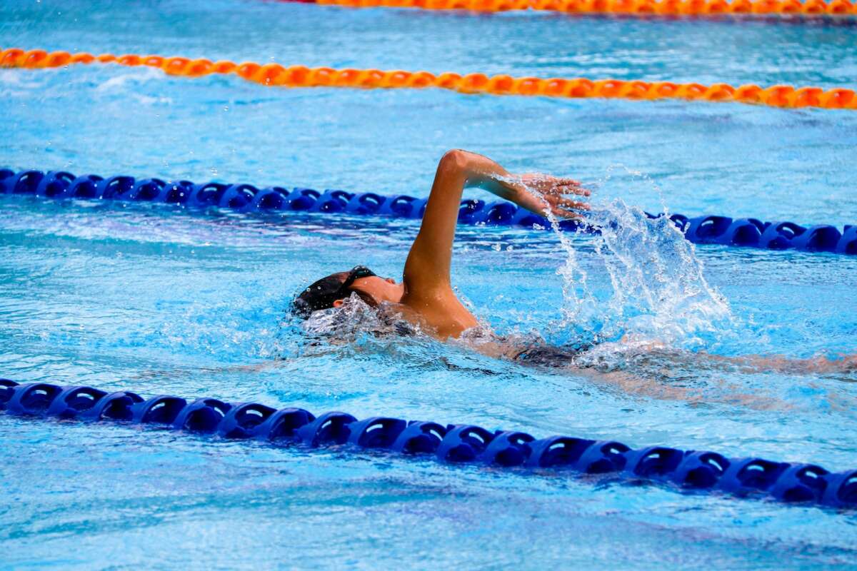 Demonstrating the basic skills in swimming