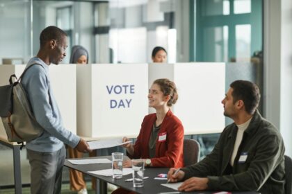 People Inside a Voting Center - meaning of civic education