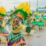 Motifs in dance: Vibrant dancers in traditional costumes perform at a lively festival in Western Visayas, Philippines.